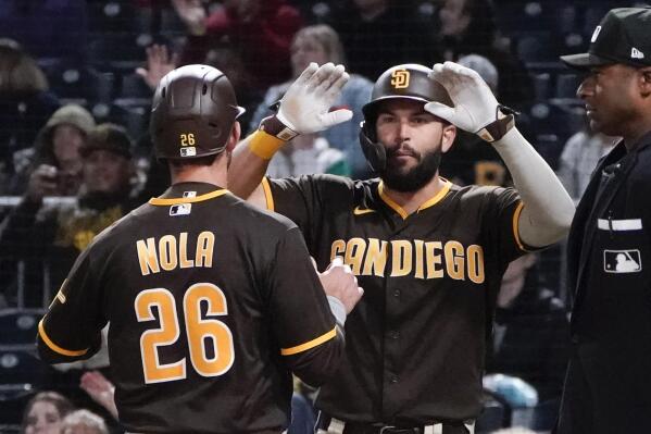 San Diego Padres' Austin Nola (26) and Eric Hosmer celebrate after scoring on a Trayce Thompson hit to left field during the sixth inning of a baseball game against the Pittsburgh Pirates, Friday, April 29, 2022, in Pittsburgh. (AP Photo/Keith Srakocic)