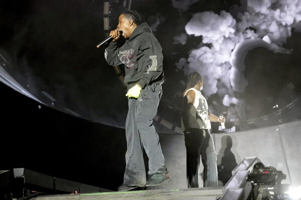 Special guest, Travis Scott, left, performs with Young Thug during the Summer Smash Music Festival on Sunday, June 22, 2025, in Bridgeview, Ill. (Photo by Rob Grabowski/Invision/AP)