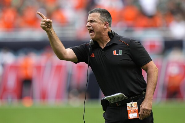 Miami head coach Mario Cristobal reacts during the first half of an NCAA college football game against Texas A&M, Saturday, Sept. 9, 2023, in Miami Gardens, Fla. (AP Photo/Lynne Sladky)