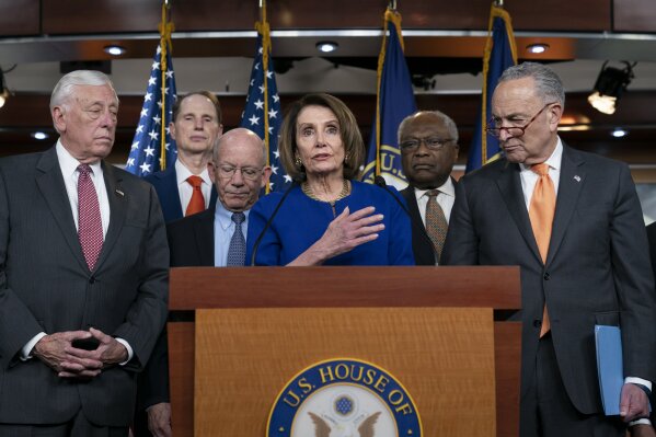 Speaker of the House Nancy Pelosi, D-Calif., center, Senate Minority Leader Chuck Schumer, D-N.Y., right, and other congressional leaders, react to a failed meeting with President Donald Trump at the White House on infrastructure, at the Capitol in Washington, Wednesday, May 22, 2019.  From left are House Majority Leader Steny Hoyer, D-Md., Sen. Ron Wyden, D-Ore., House Transportation and Infrastructure Committee Chair Peter DeFazio, D-Ore., Pelosi, House Majority Whip James E. Clyburn, D-S.C., and Schumer. (AP Photo/J. Scott Applewhite)