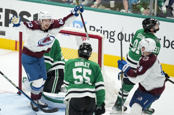 Colorado Avalanche left wing Artturi Lehkonen (62) reacts after teammate defenseman Cale Makar (8) scored a goal against the Dallas Stars during the third period in Game 5 of an NHL hockey Stanley Cup second-round playoff series, Wednesday, May 15, 2024, in Dallas. Looking on are Stars' Thomas Harley (55) and Tyler Seguin (91). (AP Photo/Tony Gutierrez)