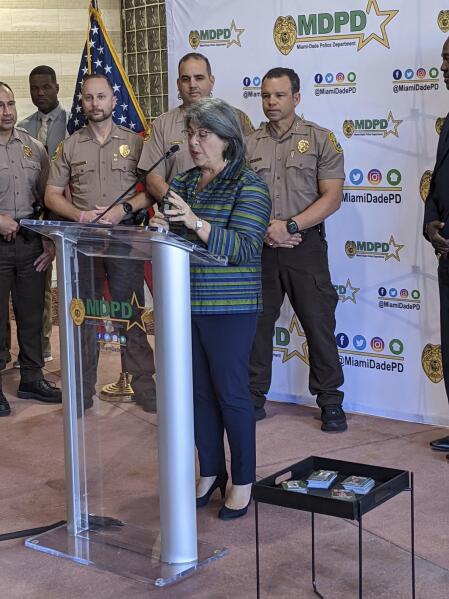 Miami-Dade County Mayor Daniella Levine Cava took part in a ceremony, Tuesday, Nov. 9, 2021, announcing a new crime-fighting initiative that will give the public information on unsolved homicides simply by using their cellphone cameras. (Charles Rabin/Miami Herald via AP)