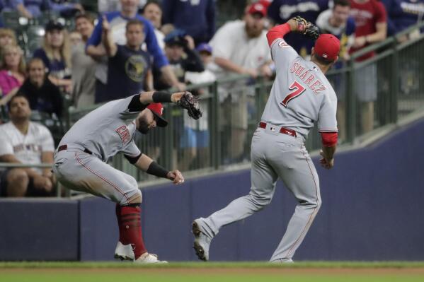 Brewers hold off Pirates 11-8, tied with Reds for NL Central lead