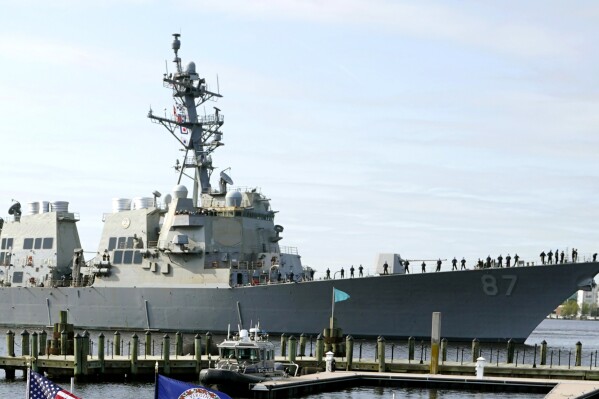 File - The USS Mason, an Arleigh Burke-class destroyer, passes a dock in Norfolk, Va., April 8, 2021. Officials said the USS Mason shot down a suspected Houthi drone flying in its direction during an incident in which two missiles fired from territory held by Yemen's Houthi rebels missed a commercial tanker loaded with jet fuel near the key Bab el-Mandeb Strait on Wednesday. (AP Photo/Steve Helber)