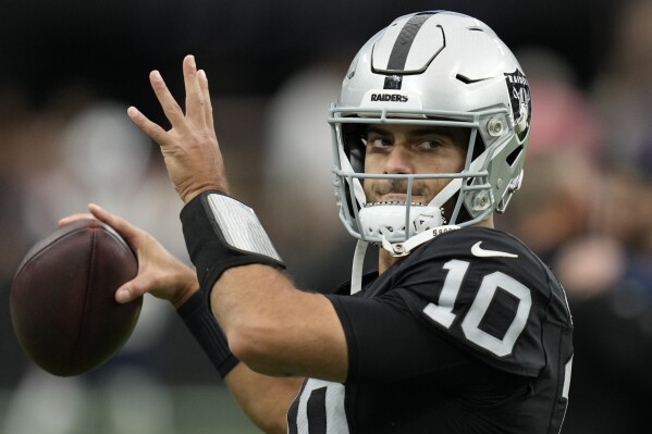 FILE - Las Vegas Raiders quarterback Jimmy Garoppolo (10) warms up before an NFL football game against the New England Patriots, Sunday, Oct. 15, 2023, in Las Vegas. Garoppolo, was by the Raiders earlier this week, has signed with the Los Angeles Rams as the backup to Matthew Stafford, the Rams announced Friday, March 15, 2024. (AP Photo/John Locher, File)