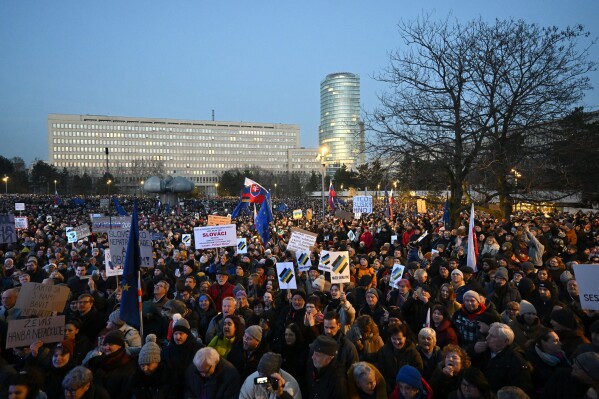 Thousands of protesters gather to oppose the policies of Slovakia's Prime Minister Robert Fico in Bratislava, Slovakia, Friday, Jan. 24, 2025. (AP Photo/Denes Erdos)
