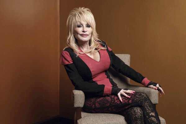 Dolly Parton poses at the Carnegie Medal of Philanthropy Ceremony in New York, on Oct. 13, 2022. Carl Dean, Dolly Parton's husband of nearly 60 years, died Monday, March 3, 2025, in Nashville, Tenn., at age 82. (AP Photo/Andres Kudacki, File)