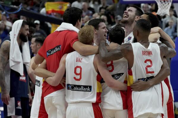 The players of team Spain celebrate winning the Eurobasket final basketball match between Spain and France in Berlin, Germany, Sunday, Sept. 18, 2022. Spain defeated France by 88-76. (AP Photo/Michael Sohn)