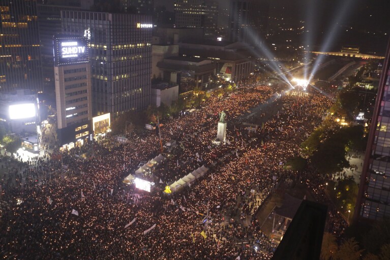 South Korean protesters stage a rally calling for South Korean President Park Geun-hye to step down in downtown Seoul, South Korea, Saturday, Nov. 5, 2016. Tens of thousands of South Koreans poured into the streets of downtown Seoul on Saturday, using words including 