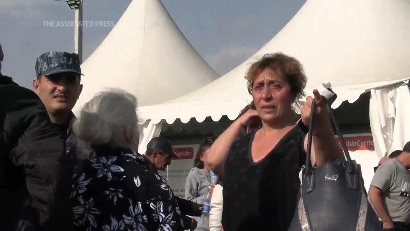 Thousands of Armenians flee Nagorno-Karabakh as the Turkish president visits Azerbaijan