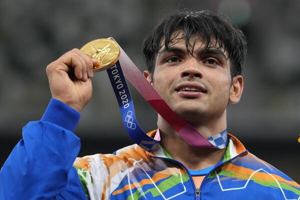 Gold medalist Neeraj Chopra, of India, poses during the medal ceremony for the men's javelin throw at the 2020 Summer Olympics, Saturday, Aug. 7, 2021, in Tokyo. (AP Photo/Martin Meissner)