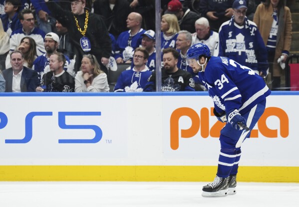 Toronto Maple Leafs' Auston Matthews (34) reacts after Boston Bruins' Brad Marchand scored an empty-net goal during the third period of Game 3 of an NHL hockey Stanley Cup first-round playoff series in Toronto on Wednesday, April 24, 2024. (Frank Gunn/The Canadian Press via AP)