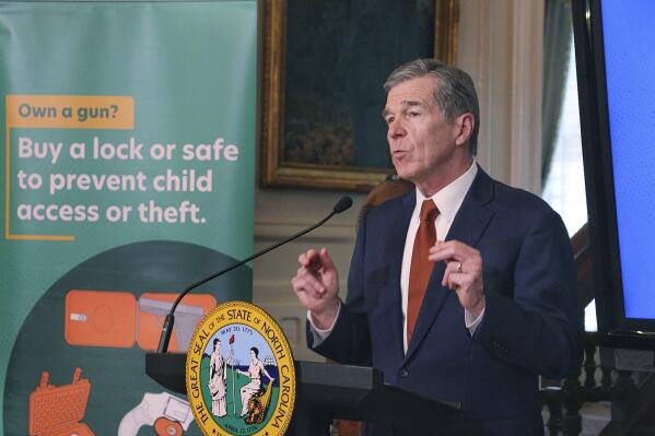 North Carolina Gov. Roy Cooper announces a new campaign promoting the safe storage of firearms, Monday, June 5, 2023, at the Executive Mansion in Raleigh, N.C. (AP Photo/Hannah Schoenbaum)