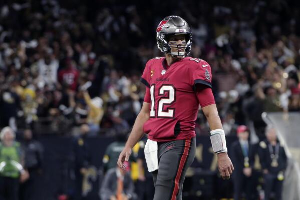 Tampa Bay Buccaneers quarterback Tom Brady (12) walks on the field in the second half of an NFL football game against the New Orleans Saints in New Orleans, Sunday, Oct. 31, 2021. (AP Photo/Butch Dill)