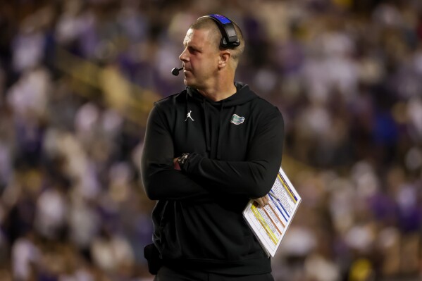 Florida head coach Billy Napier stands on the sideline during the first half of an NCAA college football game against LSU in Baton Rouge, La., Saturday, Nov. 11, 2023. (AP Photo/Derick Hingle)