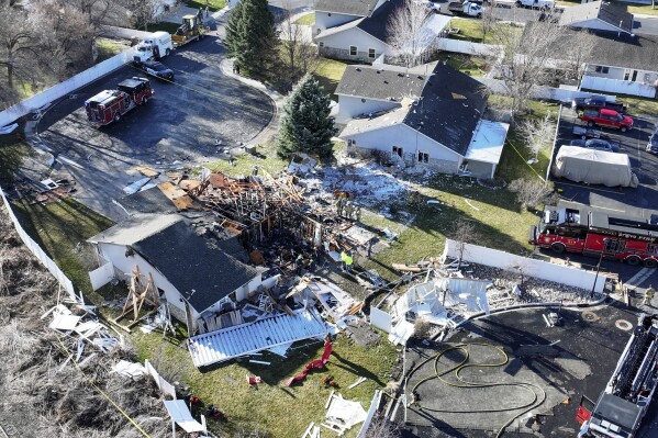 Emergency responders work at the scene of an explosion at a duplex in American Fork, Utah on Wednesday, March 20, 2024. (Kristin Murphy/The Deseret News via AP)