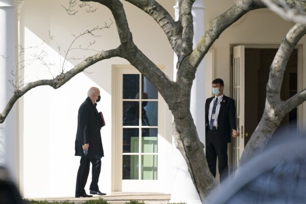 President Joe Biden walks to the Oval Office after traveling to Georgetown University to receive ashes for Ash Wednesday, Wednesday, Feb. 17, 2021, in Washington. (AP Photo/Evan Vucci)