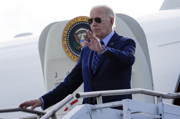 President Joe Biden waves as he arrives on Air Force One at Westchester County Airport in White Plains, N.Y., Monday, June 3, 2024. (AP Photo/Alex Brandon)