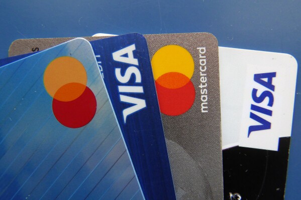 FILE - Credit cards as seen July 1, 2021, in Orlando, Fla. Many Americans say their household expenses are outpacing earnings in 2023 according to a new poll from Ǻ-NORC Center for Public Affairs Research. (Ǻ Photo/John Raoux, File)