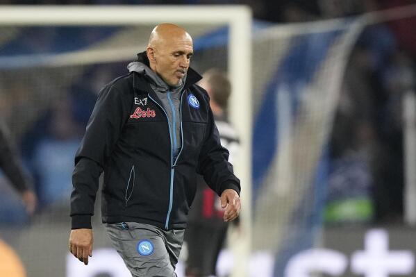 Napoli's head coach Luciano Spalletti leaves the pitch in dejection at the end of the Champions League quarterfinal second leg soccer match between Napoli and AC Milan, at Naples' Diego Armando Maradona stadium, Wednesday, April 19, 2023. (AP Photo/Andrew Medichini)