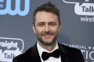 FILE - In this Jan. 11, 2018 file photo, Chris Hardwick arrives at the 23rd annual Critics' Choice Awards in Santa Monica, Calif. On Saturday, June 16, 2018, AMC Networks says Hardwick's talk show is on hold and he has withdrawn as moderator of AMC and BBC America's Comic-Con panels. (Photo by Jordan Strauss/Invision/AP)