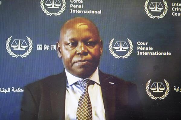 Kenyan lawyer Paul Gicheru appears before a pre-trial chamber, via video-link from the ICC detention center, before facing charges against him of bribing and threatening prosecution witnesses in the case against Kenya's recently elected President William Ruto, which was ultimately dropped amid allegations of witness interference, at the International Criminal Court in The Hague, Netherlands on Nov. 6, 2020. Kenyan police say that Gicheru was found dead at his home late Monday, Sept. 26, 2022 though it was not immediately clear how he died. (International Criminal Court via AP)