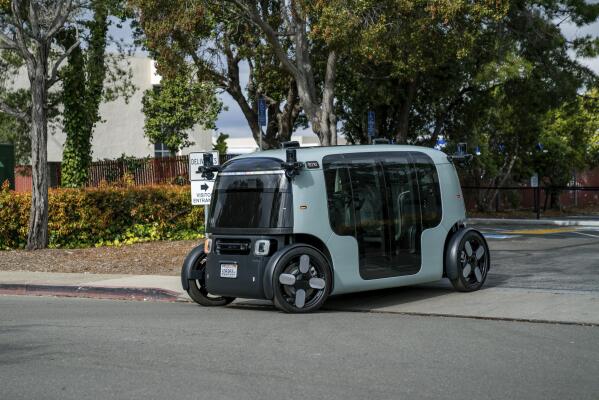This photo provided by Zoox, Inc. shows a Zoox, a self-driving vehicle in Foster City, Calif., on Saturday, Feb. 11, 2023 . The self-driving vehicle company owned by Amazon says it has successfully carried passengers on public roads. Zoox said the company conducted the first run of its four-person “robotaxi” on Feb. 11 with employees on board. (Zoox, Inc. via AP)