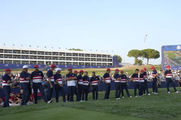 Member of the United States Ryder Cup team line up at the presentation ceremony after Europe won the Ryder Cup at the Marco Simone Golf Club in Guidonia Montecelio, Italy, Sunday, Oct. 1, 2023. (AP Photo/Alessandra Tarantino)