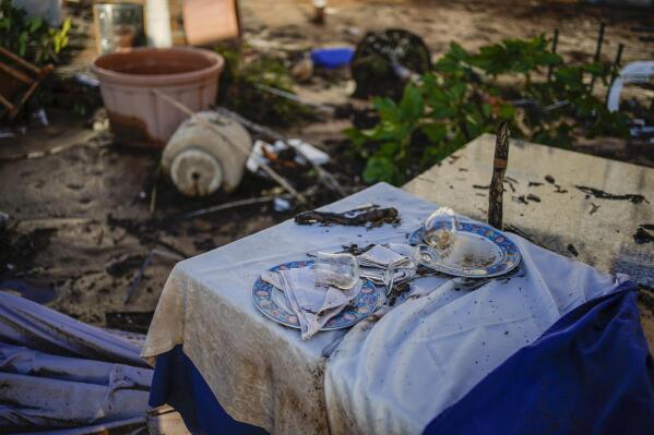 A damaged terrace restaurant after flooding in a seaside town of Alcanar, in northeastern Spain, Thursday, Sept. 2, 2021. A downpour Wednesday created flash floods that swept cars down streets in the Catalan town of Alcanar. Most of mainland Spain is under alert for heavy rains. (AP Photo/Joan Mateu Parra)