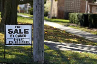 A "For Sale by Owner" sign is displayed in front of a home in Niles, Ill., Friday, Nov. 1, 2024. (AP Photo/Nam Y. Huh)