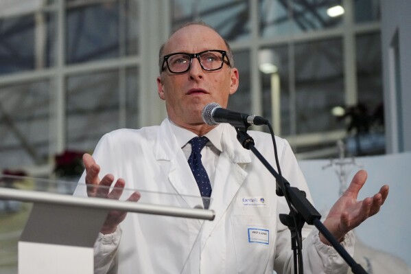 Surgeon Sergio Alfieri speaks to journalists, Friday, Feb. 21, 2025, in the entrance hall of Rome's Agostino Gemelli Polyclinic where Pope Francis is being treated for pneumonia. (AP Photo/Alessandra Tarantino)