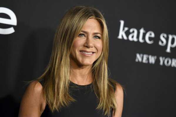 FILE - Jennifer Aniston arrives at the fourth annual InStyle Awards on Oct. 22, 2018, in Los Angeles. Aniston is among the celebrities taking part in an Aug. 20 virtual reading of the script for 1982's “Fast Times at Ridgemont High" as an online fundraiser. (Photo by Jordan Strauss/Invision/AP, File)