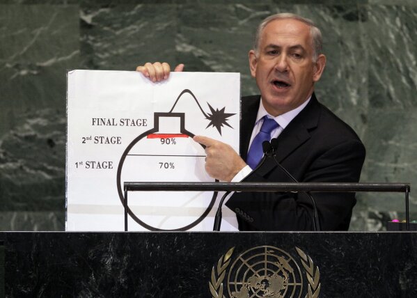 FILE - In this Sept. 27, 2012 file photo, Prime Minister Benjamin Netanyahu of Israel shows an illustration as he describes his concerns over Iran's nuclear ambitions during his address to the 67th session of the United Nations General Assembly at U.N. headquarters. As Netanyahu becomes Israel’s longest-serving prime minister, he is solidifying his place as the country’s greatest political survivor and the most dominant force in Israeli politics in his generation. (AP Photo/Richard Drew, File)
