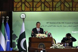Chinese Foreign Minister Wang Yi speaks at the start of a two-day gathering of the 57-member Organization of Islamic Cooperation, at the Parliament House in Islamabad, Pakistan, Tuesday, March 22, 2022. Pakistan's Prime Minister Imran Khan urged foreign ministers from Muslim-majority nations to help end Russia's war in Ukraine, appealing also on China's foreign minister, Wang Yi, who attended for the first time as a special guest, to join the effort. (AP Photo/Rahmat Gul)