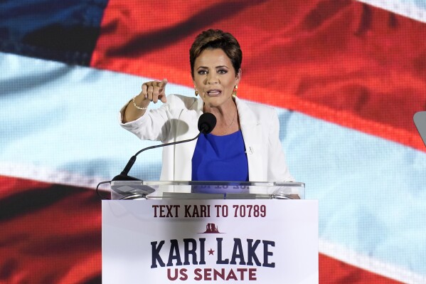 Republican candidate Kari Lake announces her plans to run for the Arizona U.S. Senate seat during a rally, Tuesday, Oct. 10, 2023, in Scottsdale, Ariz. (AP Photo/Ross D. Franklin)