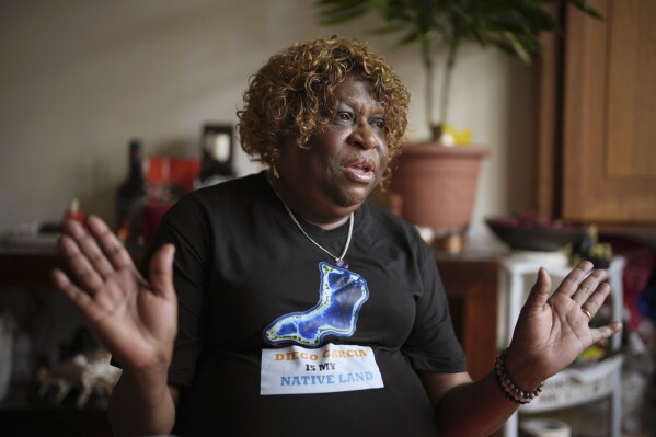 Chagossian Bernadette Dugasse speaks, during an interview with The Associated Press, at her home in London, Tuesday, March 25, 2025. (AP Photo/Kin Cheung)