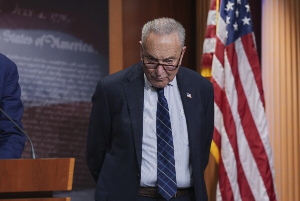 Senate Minority Leader Chuck Schumer, D-N.Y., talks to reporters about Senate Republicans' efforts to pass President Donald Trump's tax cut and spending agenda with deeper Medicaid cuts, at the Capitol in Washington, Wednesday, June 18, 2025. (AP Photo/J. Scott Applewhite)