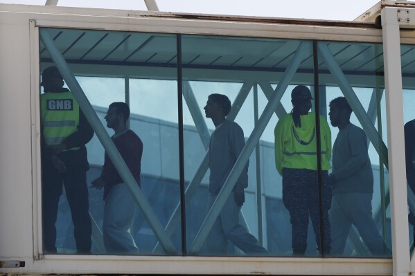 Venezuelan migrants deported from the United States arrive at Simon Bolivar International Airport in Maiquetia, Venezuela, Sunday, March 30, 2025. (AP Photo/Cristian Hernandez)