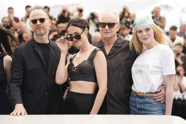 Director Joachim Trier, from left, Renate Design, Stellan Skarsgard and Elle Fanning Pose for photographers in the photo 