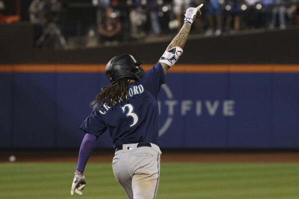 J.P. Crawford of the Seattle Mariners runs to first base during