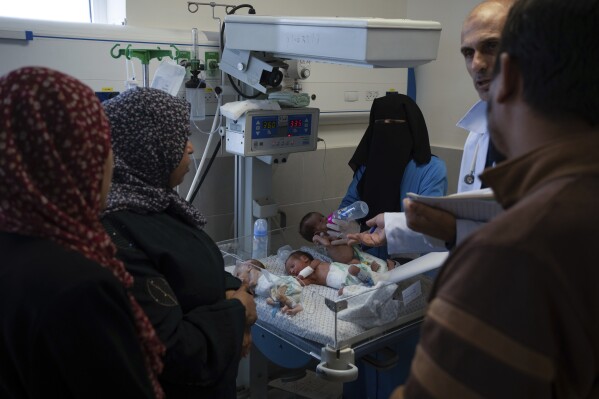 Medics prepare premature babies for transport to Egypt after they were evacuated from Shifa Hospital in Gaza City to a hospital in Rafah, Gaza Strip, Monday, Nov. 20, 2023. (AP Photo/Fatima Shbair)