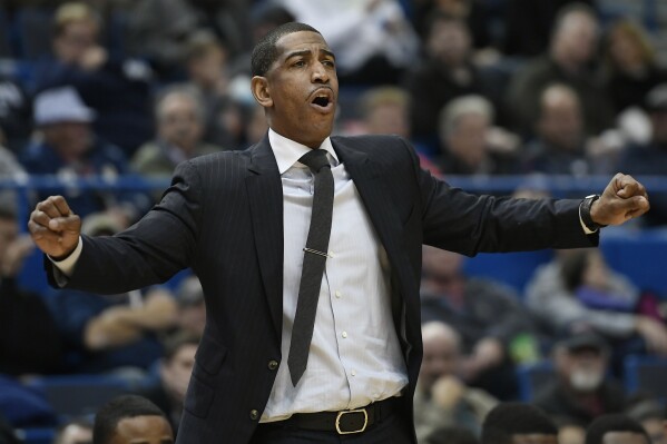 FILE - Connecticut head coach Kevin Ollie calls out to his team during the second half of an NCAA college basketball game against Stony Brook in Hartford, Conn., Tuesday, Nov. 14, 2017. Ollie, who guided UConn to a national championship, was among five assistants hired Tuesday, June 20, 2023, by the Brooklyn Nets for Jacque Vaughn's first full season as coach.(AP Photo/Jessica Hill, File)