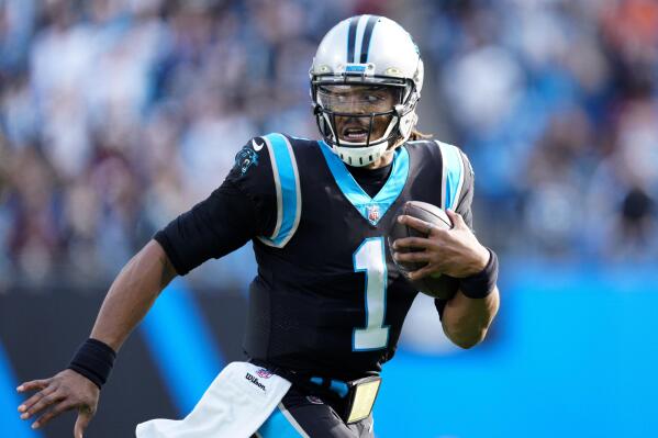 Carolina Panthers quarterback Cam Newton (1) leads the huddle in