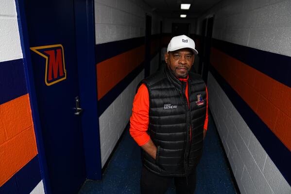 Kenny Monday, head coach of the Morgan State University wrestling team, poses for a photograph, Wednesday, April 19, 2023, in Baltimore. Monday was the first Black wrestler to win an Olympic gold medal. With a major assist from the HBCU Wrestling Initiative, next year, Morgan State will become the only historically Black college or university to offer Division I wrestling. The school had cut the sport back in 1997. (AP Photo/Julio Cortez)