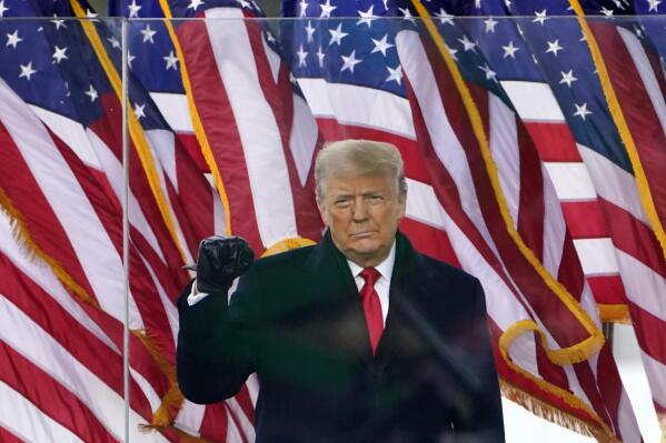 FILE - President Donald Trump gestures as he arrives to speak at a rally in Washington, Jan. 6, 2021. A lawyer for Trump said Thursday, March 30, 2023, that he has been told that the former president has been indicted in New York on charges involving payments made during the 2016 presidential campaign to silence claims of an extramarital sexual encounter. (AP Photo/Jacquelyn Martin, File)