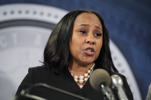 Fulton County District Attorney Fani Willis speaks in the Fulton County Government Center during a news conference, Monday, Aug. 14, 2023, in Atlanta. Donald Trump and several allies have been indicted in Georgia over efforts to overturn his 2020 election loss in the state. (AP Photo/John Bazemore)