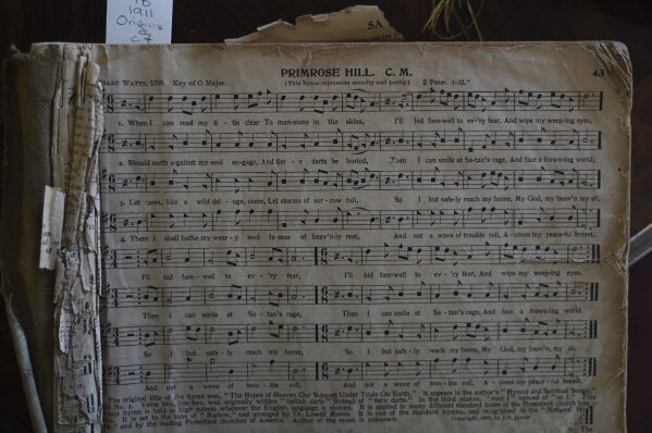 A 1911 edition of "The Sacred Harp," a shape-note hymnal from the 1800s, opened to song No. 43, "Primerose Hill," at the Sacred Harp Publishing Company and Museum in Carrollton, Ga., on Friday, March 21, 2025. (AP Photo/Jessie Wardarski)