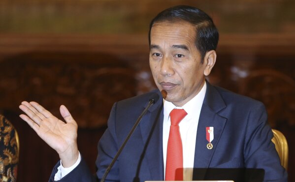 Indonesia President Joko Widodo gestures as he speaks during a press conference at the palace in Jakarta, Indonesia, Monday, Aug. 26, 2019. Indonesia's president has announced to relocate the country's capital from overcrowded, sinking and polluted Jakarta to East Kalimantan province. (AP Photo/Achmad Ibrahim)