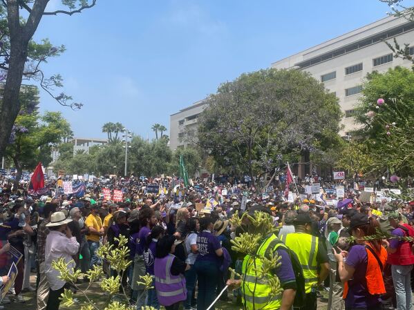 Demonstrators gather in downtown Los Angeles to protest the arrest of labor union leader David Jose Huerta Monday, June 9, 2025. (AP Photo/Jason Dearen)