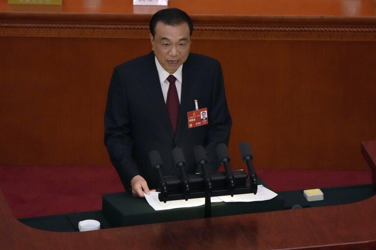 FILE - Chinese Premier Li Keqiang delivers his state of the nation address during the opening session of China's National People's Congress (NPC) at the Great Hall of the People in Beijing on March 5, 2023. Chinese state media say former Premier Li Keqiang, China’s top economic official for a decade, has died. (AP Photo/Ng Han Guan, File)